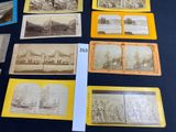 many old photographs of people and buildings on the table