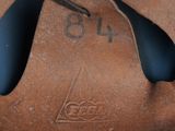 a close up of a baseball glove with a number on it