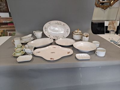a table that has a lot of dishes and cups on it