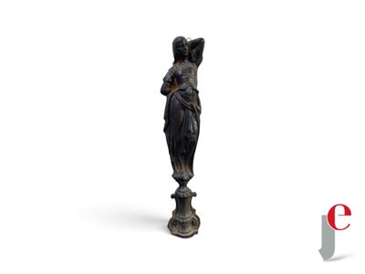 an image of a statue of a woman standing on a white surface