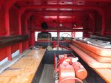 an image of a red fire truck with lots of wood