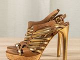 a close up of a pair of shoes on a wooden table