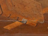 a small plane that is sitting on a wooden table
