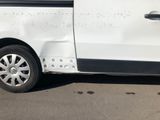 a white van with writing on the side of it