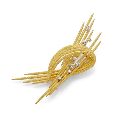 an image of a gold and diamond hair comb