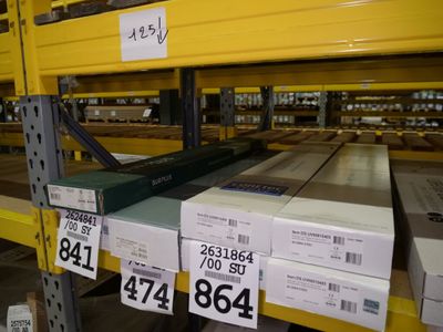 many boxes on the shelves in the warehouse