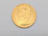 an image of a gold coin with a man ' s face on it