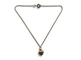 a necklace with a heart shaped pendant on a chain