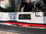 a close up of a car ' s rear bumper with wires attached to it