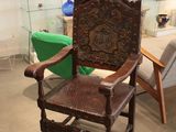 a wooden chair that is sitting in a room