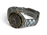 a watch that is sitting on a bracelet on a white surface