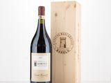 a bottle of red wine next to a wooden box