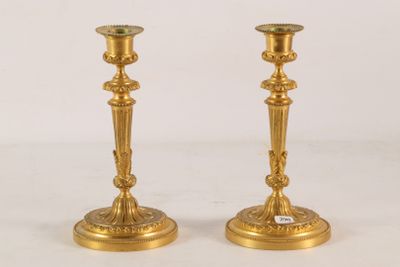pair of antique brass candlesticks with green glass top