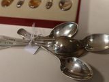 a box of spoons sitting on a table next to a box of spoons
