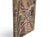 a close up of a stone block with a design on it