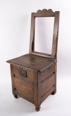 a small wooden dresser with a mirror on top of it