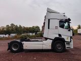 a white truck that is parked in the dirt
