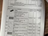 papers on a table with a calculator and a calculator on it