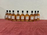 six bottles of liquor lined up on a table
