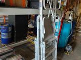 a stack of boxes and other items in a garage