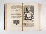 an open book with a picture of a man in a robe