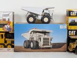 a lot of toy trucks that are sitting on a table