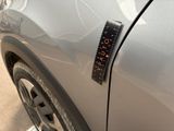 a sticker on the side of a car with a clock on it