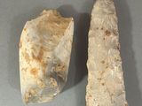 an image of two stone tools sitting on a table