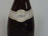 a bottle of wine that is sitting on a table