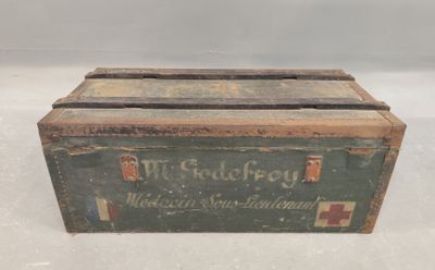 an old green box with a red cross on it