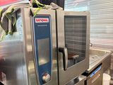 a commercial oven sitting on top of a counter in a kitchen