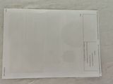 an image of a piece of paper on a bed with a sheet of paper next to it
