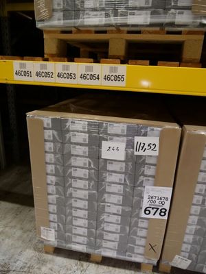 two boxes that are sitting on a pallet in a warehouse