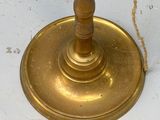 a candle that is sitting on a table with a chain around it