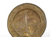 gold plate with eiffel tower in the center