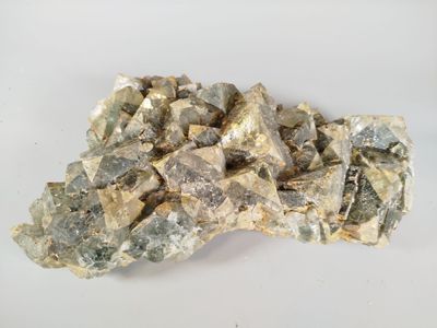some rocks and gravel on a white surface with a white background