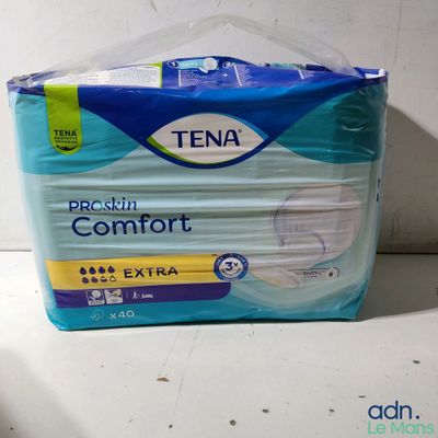 a box of tena comfort extra pads on a counter
