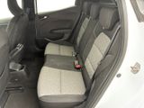 the back seats of a white car with a black seat belt