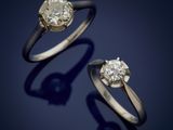 a pair of diamond rings on a blue background