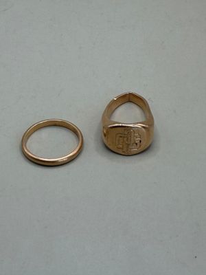 two rings that are sitting next to each other on a table