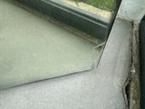 a mirror that is sitting on a window sill