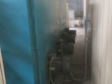 an image of a blue machine in a building
