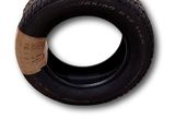 a tire with a sticker on it on a white background
