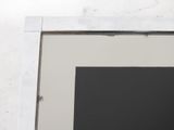 a picture of a black and white picture on a white wall
