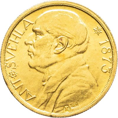 gros plan d'une pièce d'or sur laquelle figure le visage d'un homme