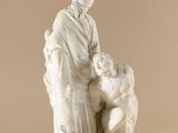 an image of a statue of a woman holding a child
