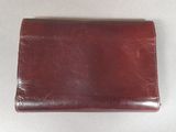 leather wallet on a white surface