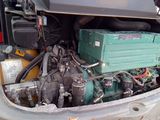 a small engine in the back of a truck