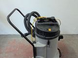 a machine that is sitting on the floor next to a wall