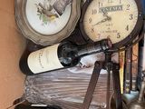 a box full of wine bottles and a clock in it